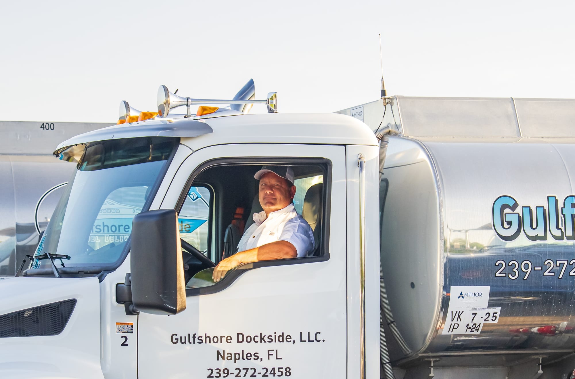 A Gulfshore Dockside driver at the wheel of his tanker, Naples, Florida