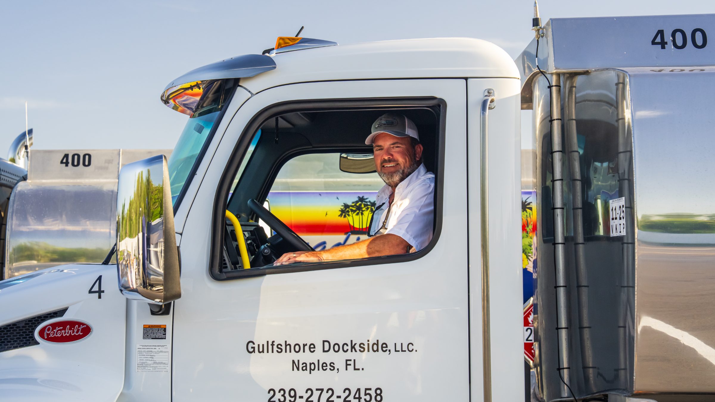 A Gulfshore Dockside driver at the wheel of a tanker, Naples, Florida