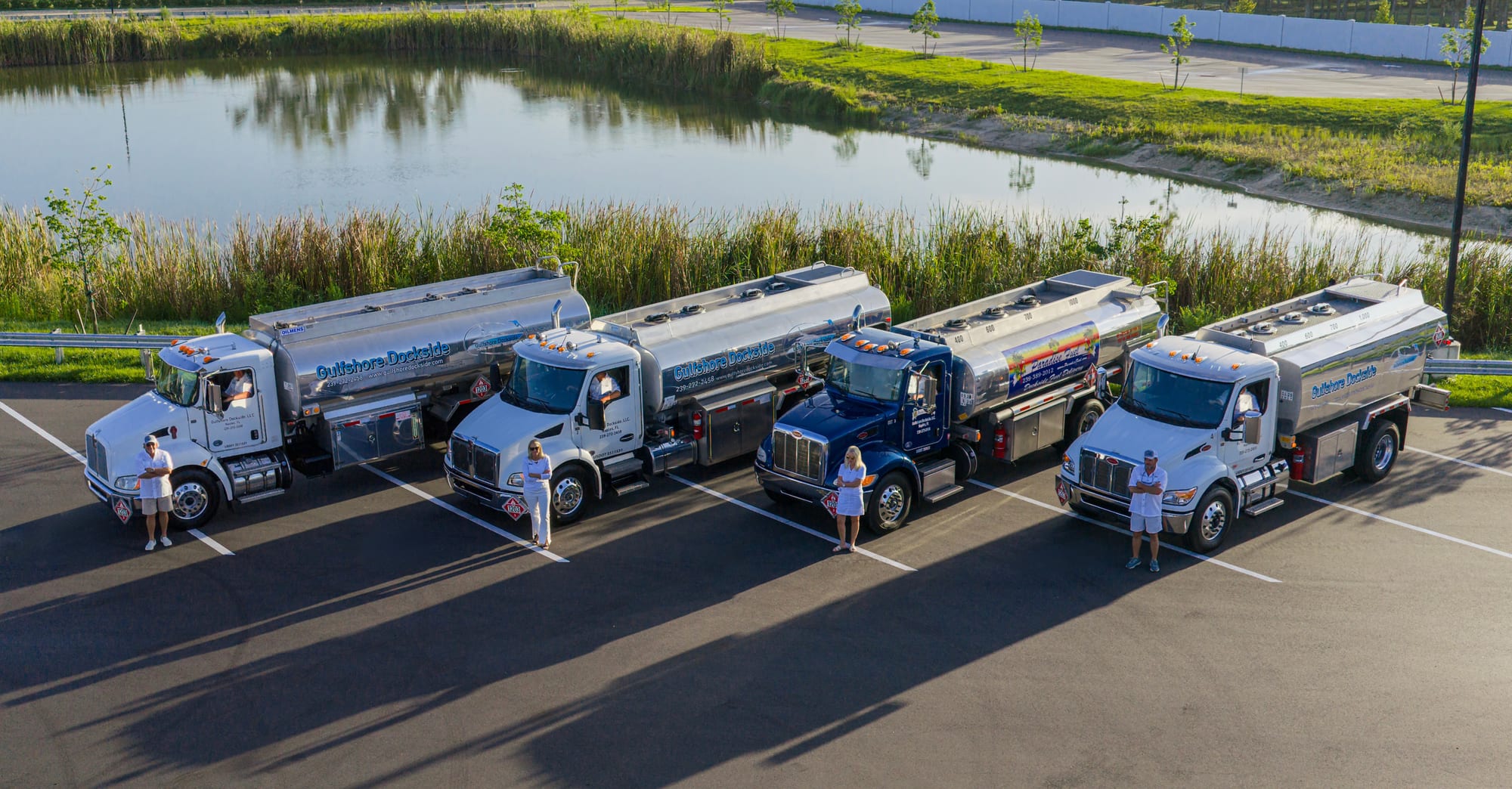 The four Gulfshore Dockside drivers standing at their tankers, lined up at the Naples yard at first light